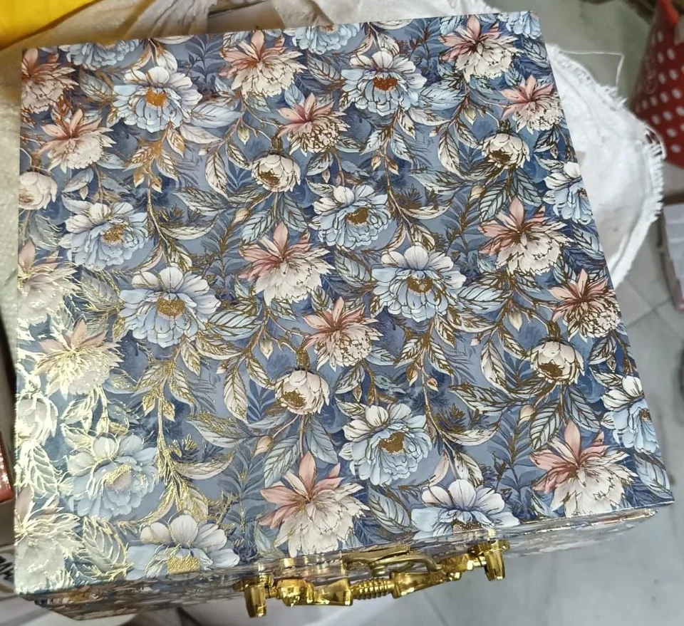 Blue floral gift box with a gold-tone handle