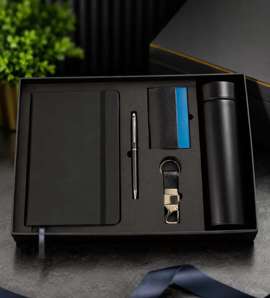 Notebook, pen, card holder, keychain and flask set