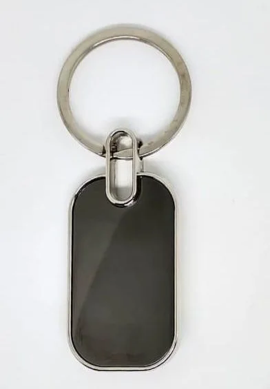 Black tag keychain with a silver rim